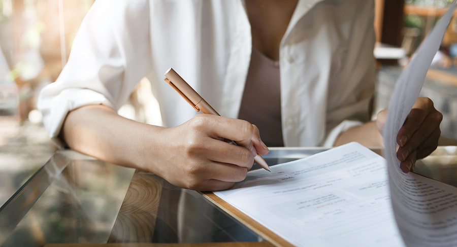 bigstock-Focus-At-Pen-On-Female-Hand-Si-455916111