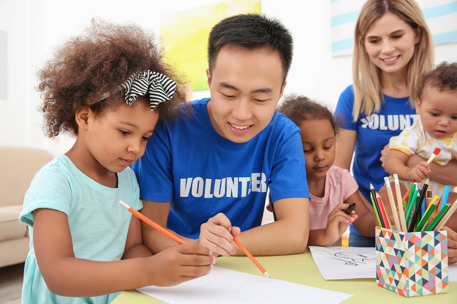 bigstock-Young-male-volunteer-drawing-w-217831780